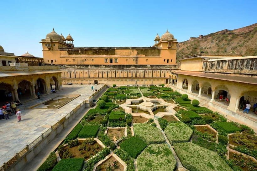 Jaipur: Amber Fort, Stepwell & Jal Mahal with Pickup - Stop 3: Jal Mahal on Man Sagar Lake for Iconic Photos and Architecture Mystery